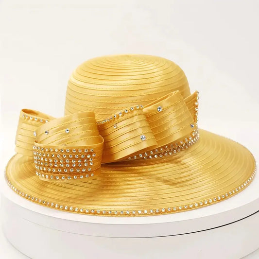 Front view of a champagne gold rhinestone formal church hat with elegant brim