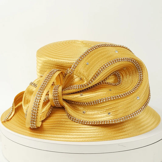 Elegant gold church hat with rhinestone embellishments and satin ribbon for women, perfect for formal events like weddings and church services.