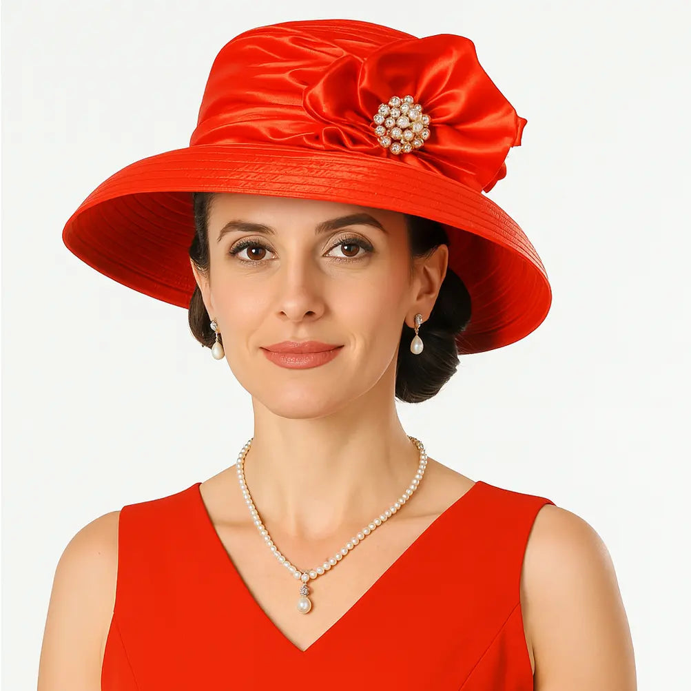 Bold red church hat with pleated satin brim and glamorous flower accent
