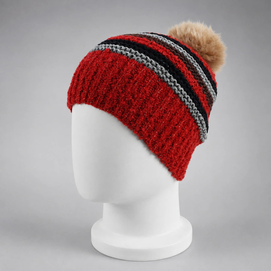 Red striped knit pom pom beanie with a fixed faux fur pom on a white mannequin