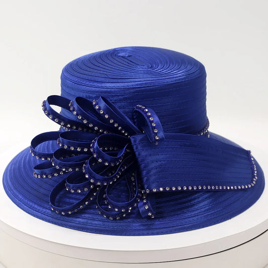 Elegant royal blue church hat with rhinestone-embellished loops and satin finish, displayed on a white background — perfect for weddings and church events.
