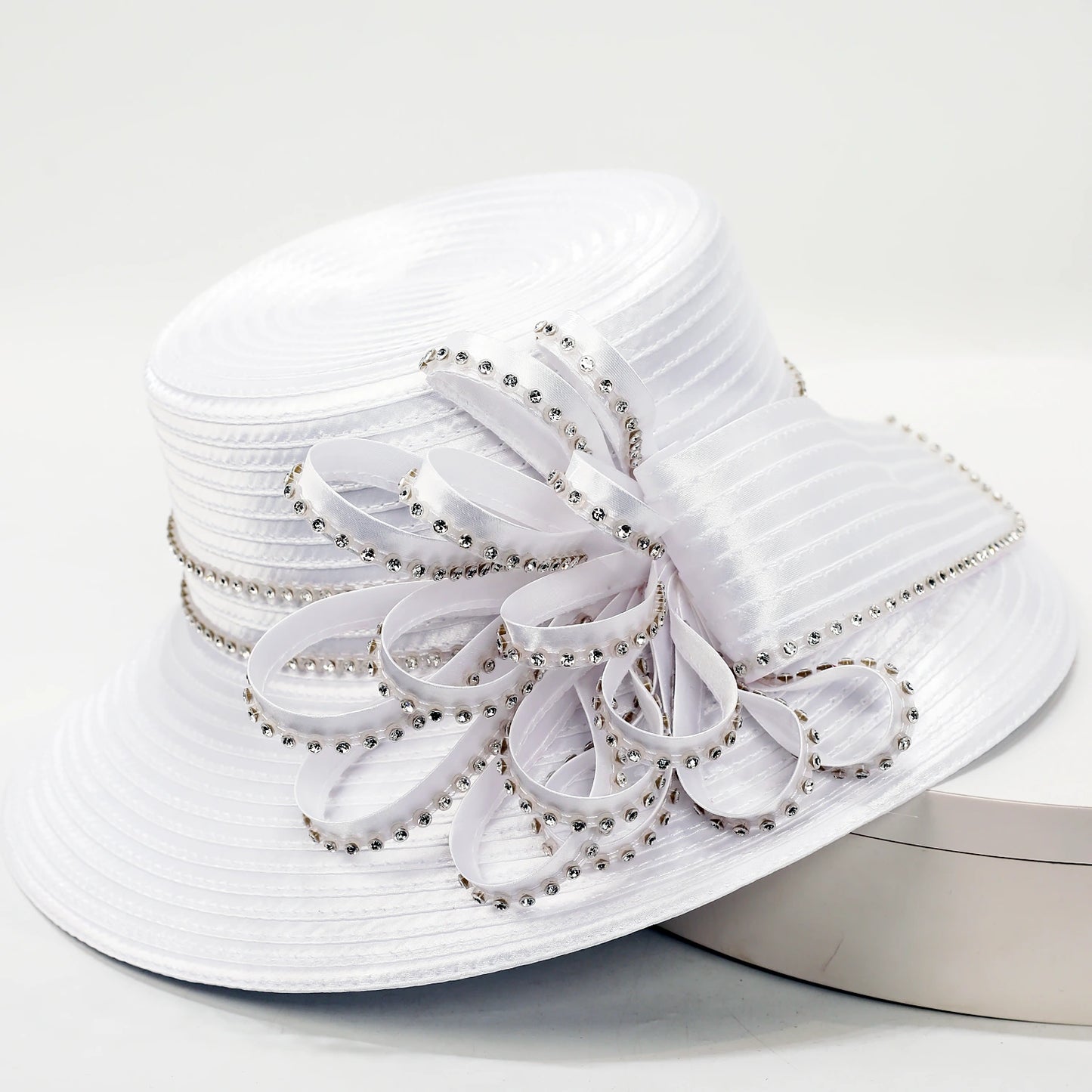 Wide brim women’s white church hat with sparkly rhinestone details and decorative bow for formal occasions