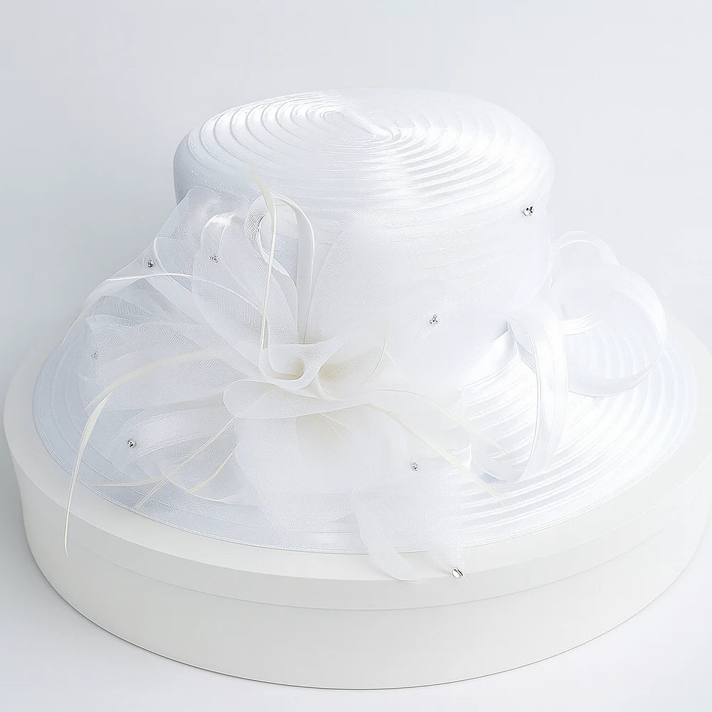 Front view of elegant white wide brim church hat with feather and crystal details – FORBUSITE