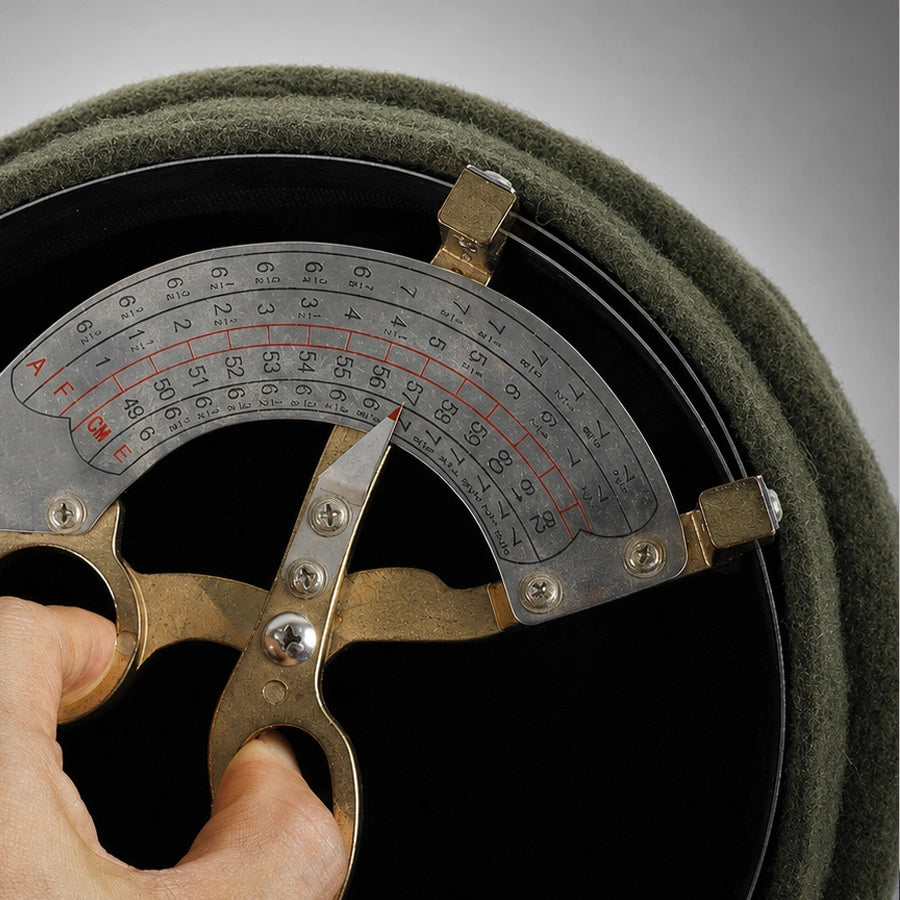 Adjustable sweatband inside wool newsboy cap measuring about 57 cm