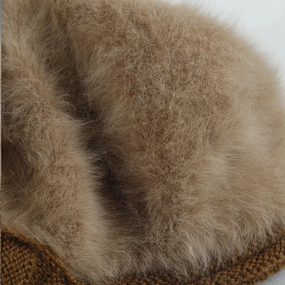 Close-up of angora-blend fuzzy knit texture on women’s visor beanie