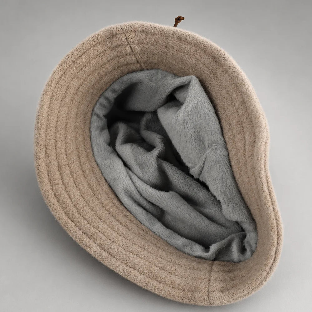 Interior of an Angora cloche hat showing full fleece lining and flexible all-around brim