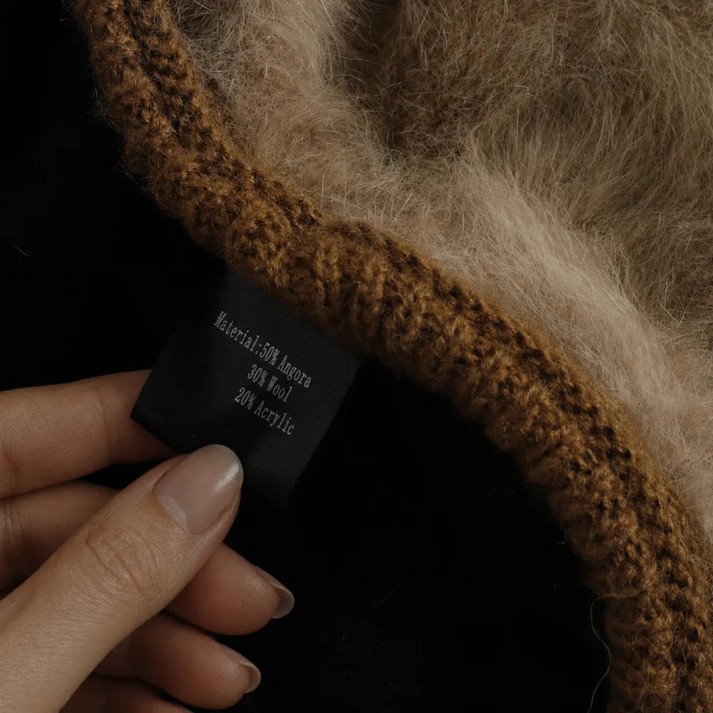Material label showing 50 percent angora 30 percent wool and 20 percent acrylic