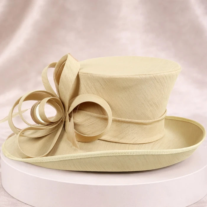 Elegant apricot church hat for women with satin ribbons and veil detail, perfect for formal occasions and weddings
