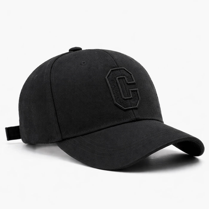 Black cotton baseball cap with subtle 'C' embroidery, offering a classic and stylish look for casual outings.