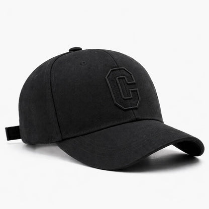 Black cotton baseball cap with subtle 'C' embroidery, offering a classic and stylish look for casual outings.