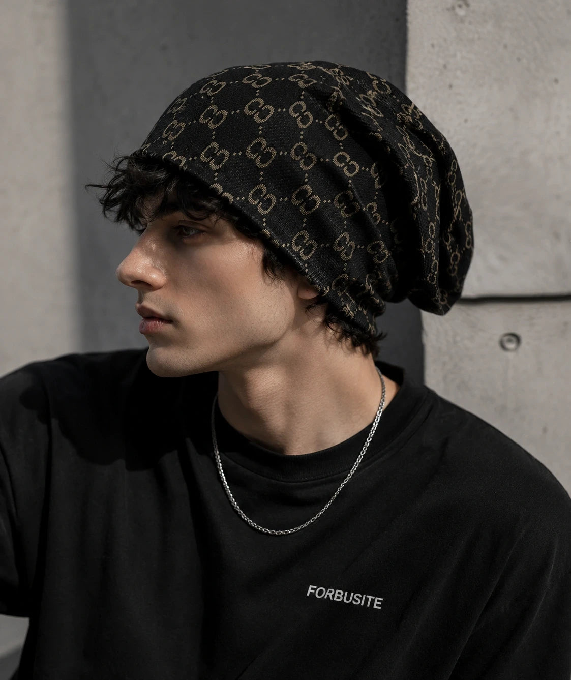 Black baggy beanie hat for men featuring vintage-inspired double C jacquard knit, oversized slouch fit, urban streetwear look.