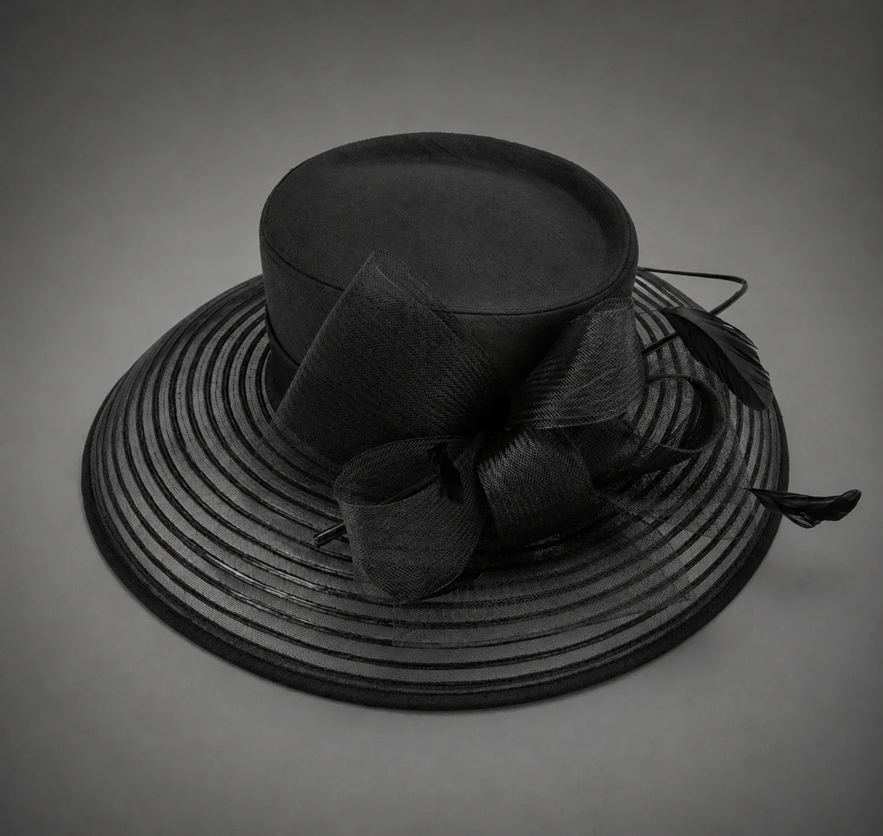 Black church hat product detail with sheer mesh brim feather bow and structured crown
