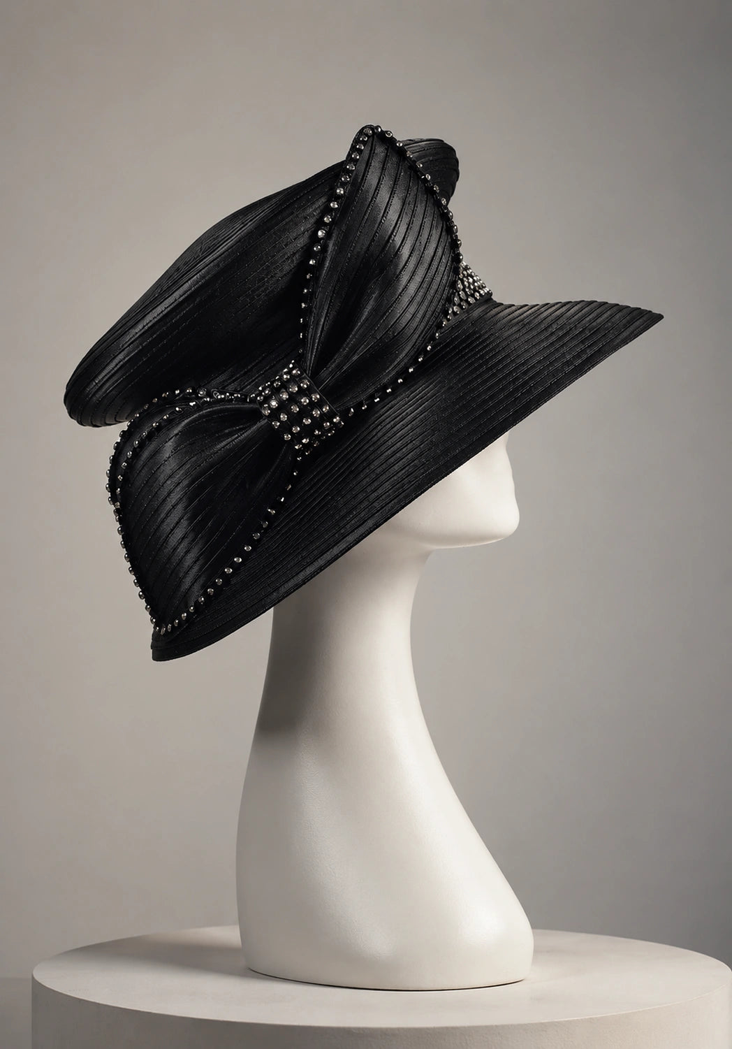 Side view of black church hat on mannequin with rhinestone bow and wide brim, elegant women’s dress hat for church and formal occasions
