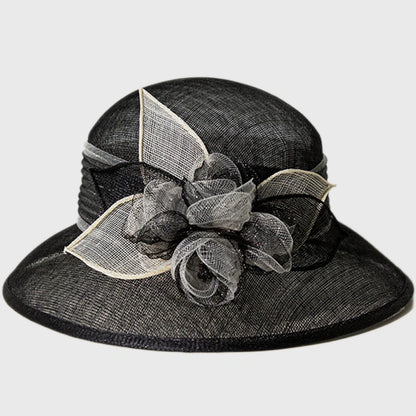 Elegant black cloche sinamay hat with black and white flower details, perfect for weddings, church services, and upscale events.