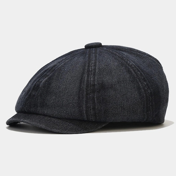 Black denim Newsboy cap, offering a vintage workwear look with a flat brim and soft construction, perfect for modern and retro-inspired street style.