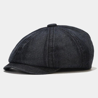 Black denim Newsboy cap, offering a vintage workwear look with a flat brim and soft construction, perfect for modern and retro-inspired street style.