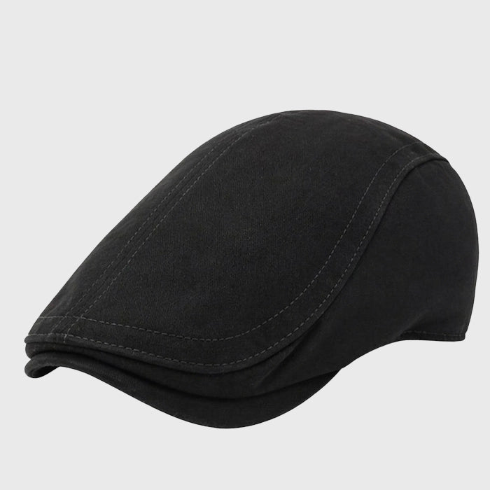 Classic black flat cap in cotton, providing a sharp and modern style. Ideal for both men and women, this Ivy cap suits any casual or semi-formal occasion.