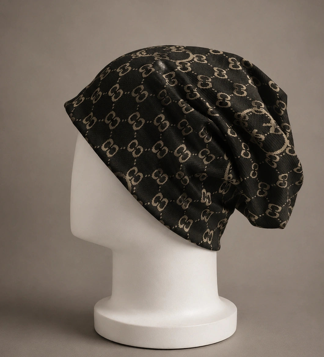 Black jacquard slouchy beanie hat with double C print, oversized baggy fit, lightweight knit beanie for men and women, side view on mannequin.