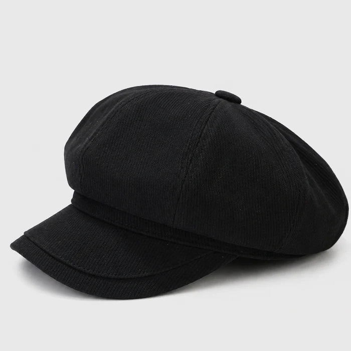 Classic black Newsboy cap with a flat brim, offering a stylish and sophisticated look. Perfect for a modern take on a vintage cabbie hat.