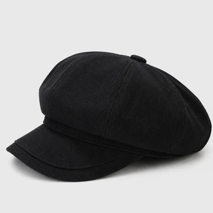 Classic black Newsboy cap with a flat brim, offering a stylish and sophisticated look. Perfect for a modern take on a vintage cabbie hat.