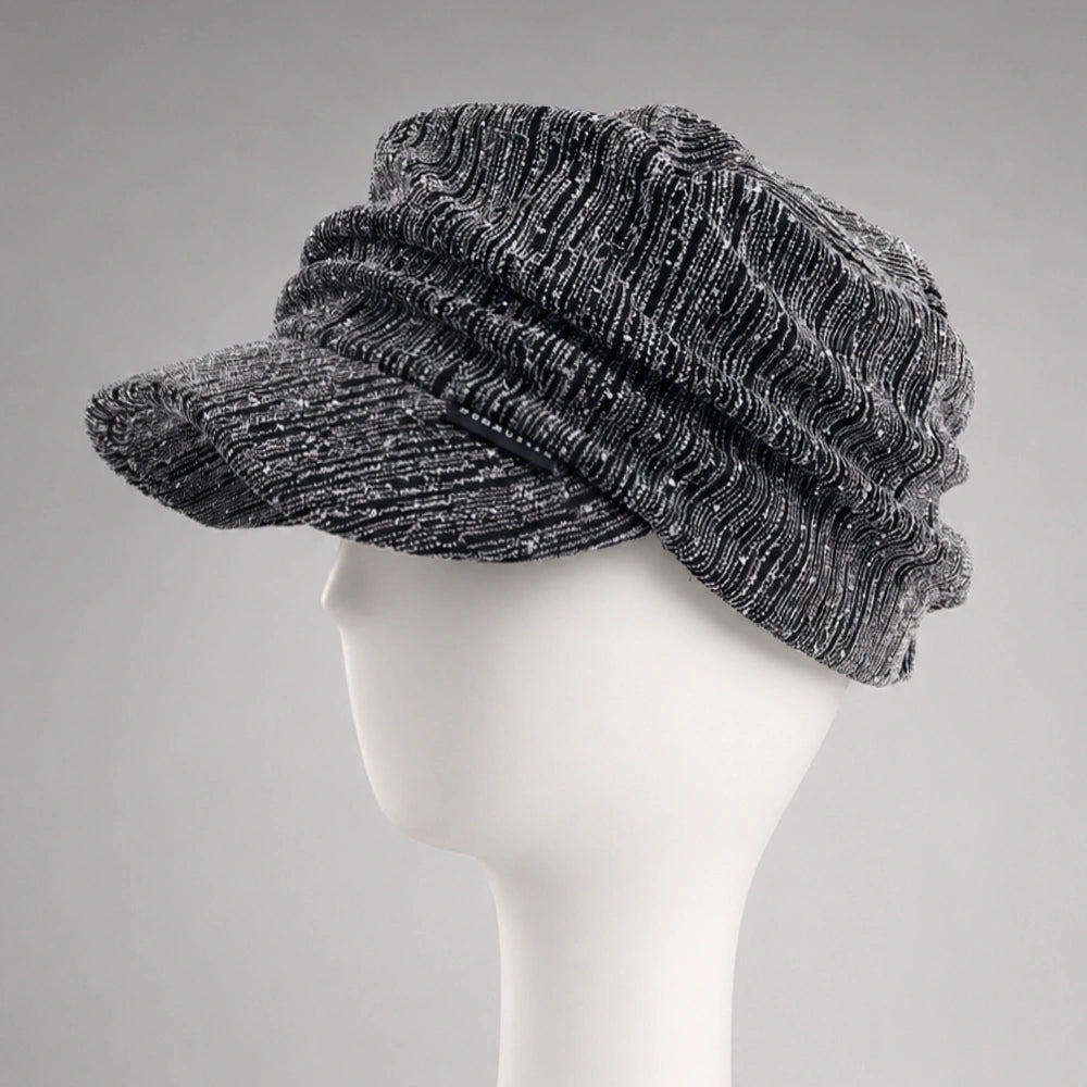 Black and silver women’s ruched visor cap showing textured fabric and soft crown drape