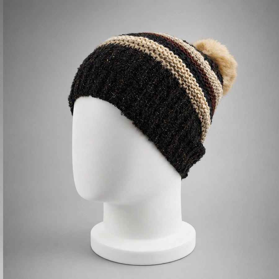 Black striped knit pom pom beanie on a white mannequin