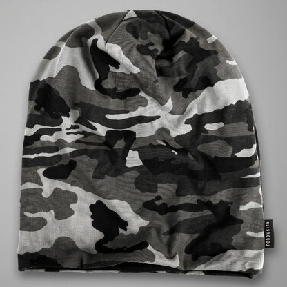 Black and white camo slouchy beanie laid flat, showing its uncuffed shape