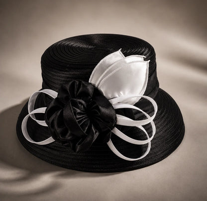 Flat lay of black and white cloche short brim church hat with ribbon flower detail, elegant formal hat for women, FORBUSITE premium hat