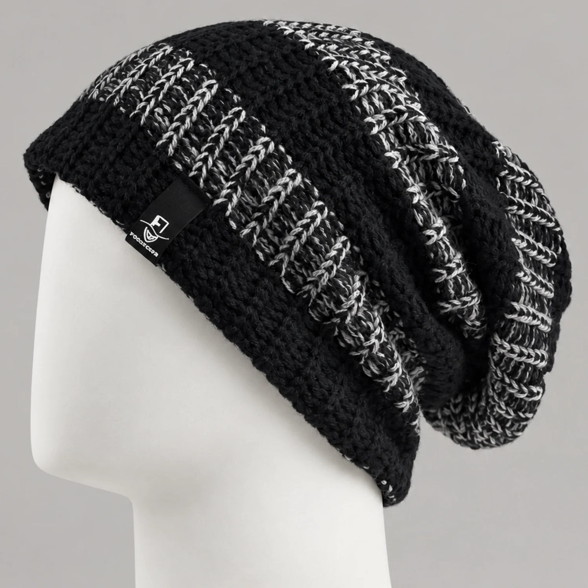 Black and white striped knit slouchy beanie with a relaxed long fit