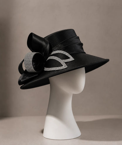 Black wide brim church hat with rhinestone ribbon displayed on minimalist mannequin