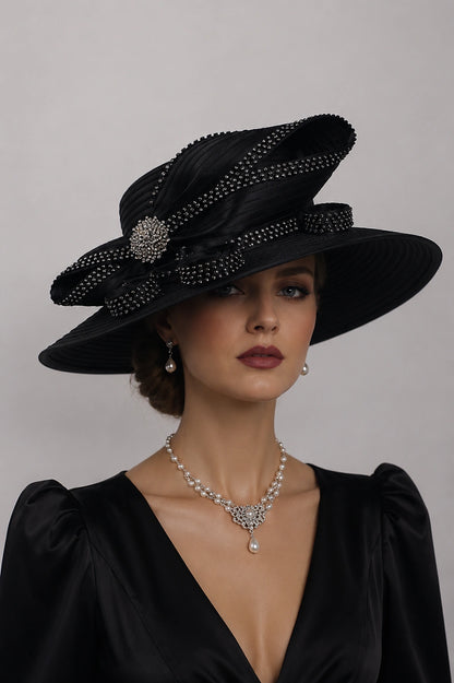 Black wide brim Sunday hat worn by elegant woman with pearl jewelry and sophisticated church fashion styling