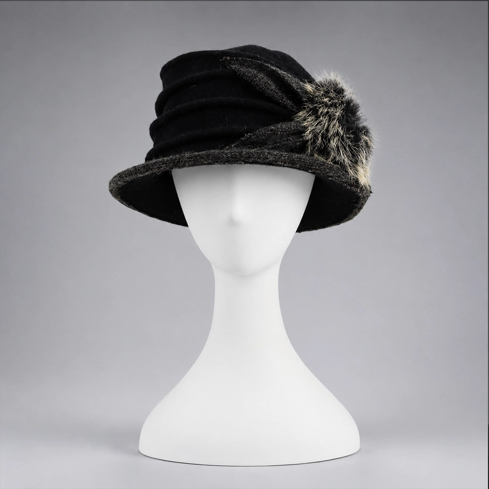 Black women’s boiled wool cloche hat with layered ruching and fixed fuzzy pom