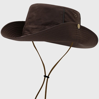 Brown boonie hat with adjustable chin strap and wide brim, providing excellent sun protection for hiking, fishing, and other outdoor adventures.