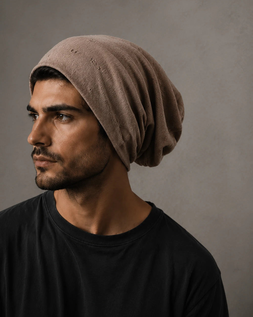 Brown slouchy beanie hat for men with relaxed oversized fit, soft distressed fabric and casual streetwear styling