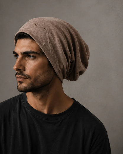 Brown slouchy beanie hat for men with relaxed oversized fit, soft distressed fabric and casual streetwear styling