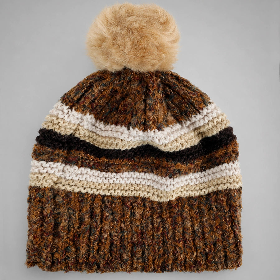 Brown striped pom pom beanie flat lay with ribbed lower section