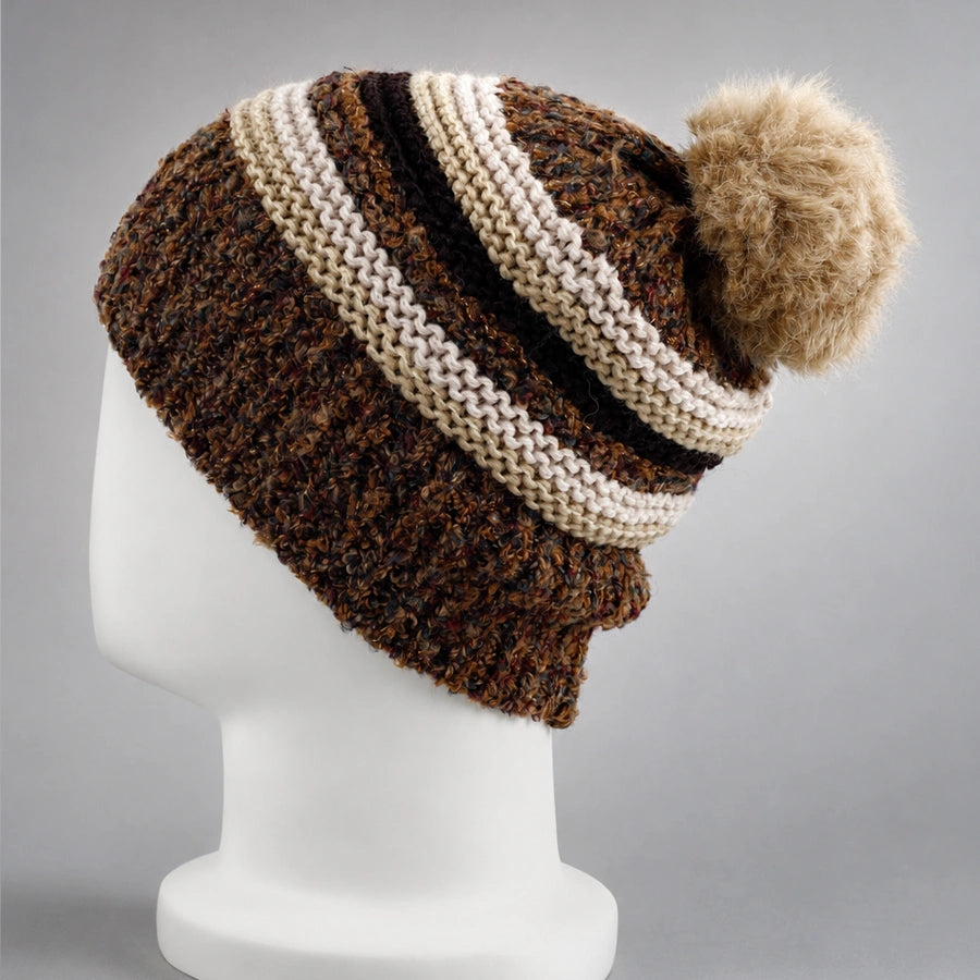 Side back view of a brown striped knit beanie with a fixed faux fur pom pom