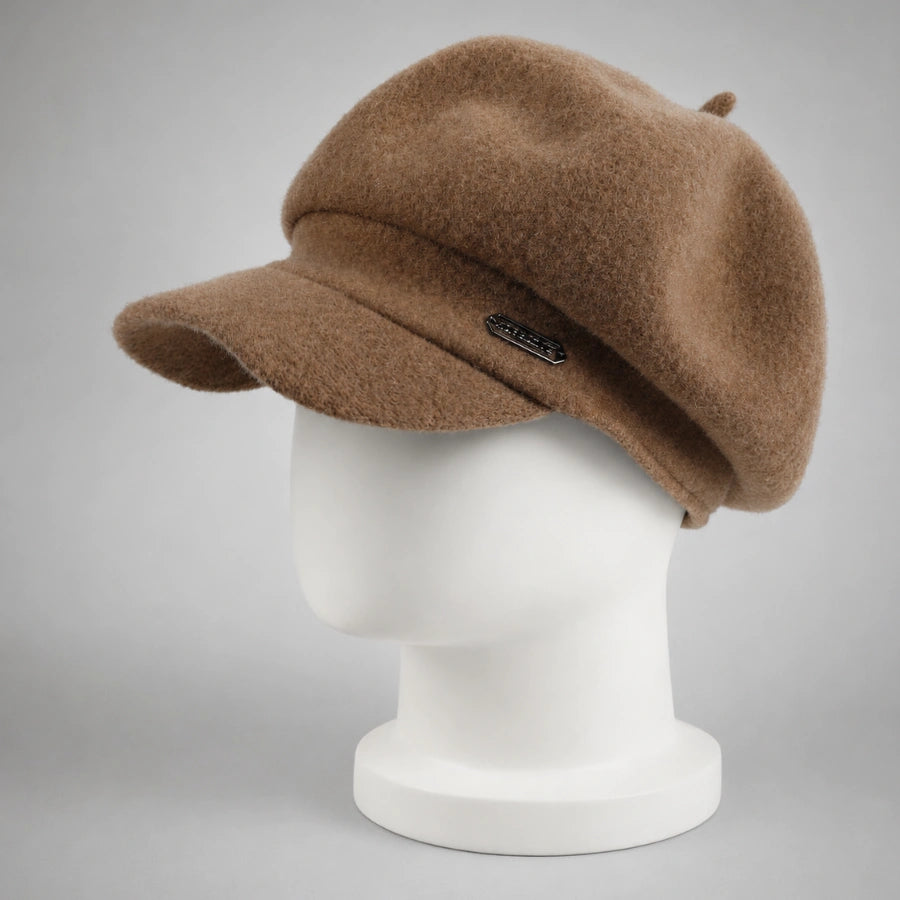 Brown women’s wool newsboy cap with short visor on mannequin