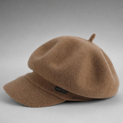 Brown wool newsboy cap with short visor in flat product view