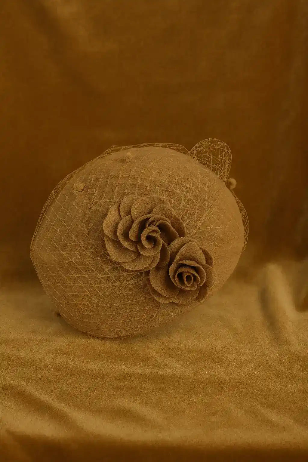 Camel brown pillbox fascinator hat with floral decor and veil