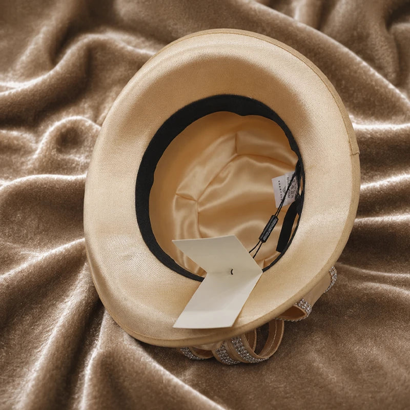 Interior view of champagne women’s church hat showing satin lining and structured crown design for comfortable formal wear