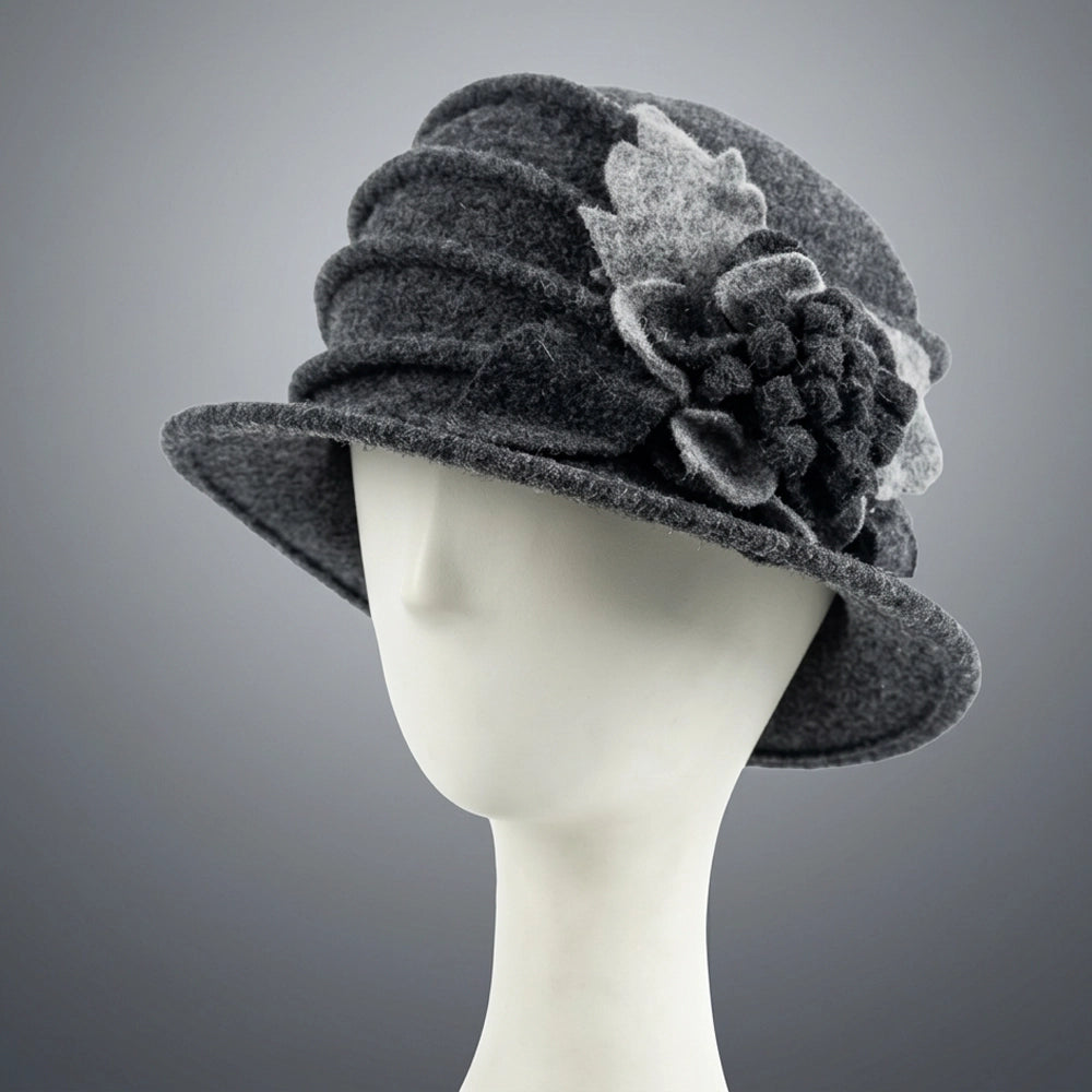 Charcoal gray wool felt cloche hat with a ruched crown and floral side detail
