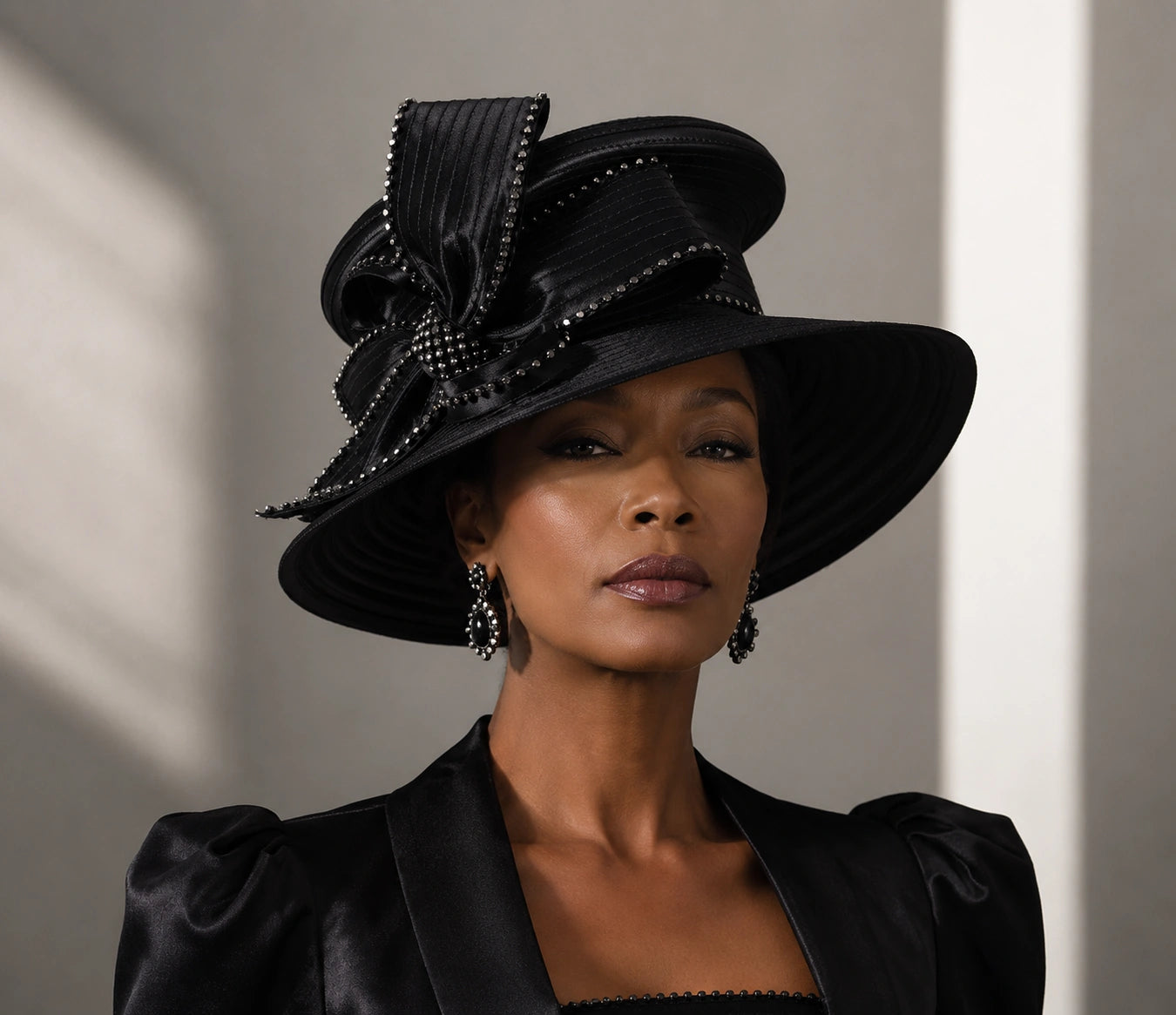 Close-up of black church hat texture with rhinestone details, showcasing high-quality satin material and intricate craftsmanship