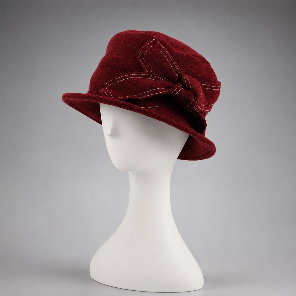 Front view of a claret wool felt cloche hat with short all-around brim