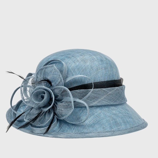 Sophisticated blue cloche sinamay hat with a stylish black ribbon and floral feather detail, perfect for afternoon teas or social functions.