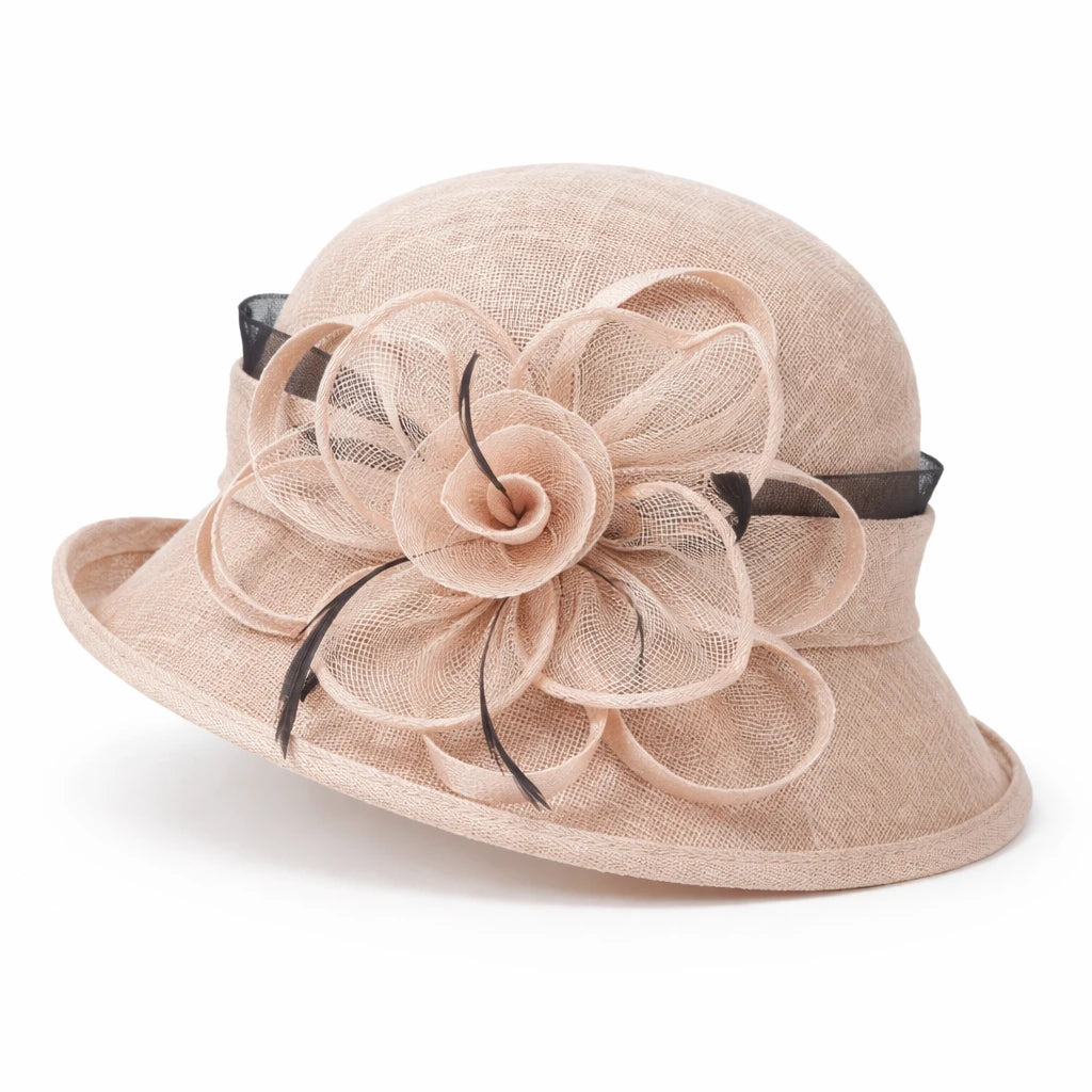Charming pink cloche sinamay hat featuring a large flower and feather detail, perfect for weddings, church events, and special occasions.