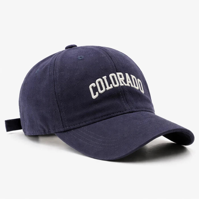Navy blue 'COLORADO' baseball cap, ideal for sporty streetwear and casual outdoor outfits.