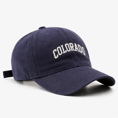Navy blue 'COLORADO' baseball cap, ideal for sporty streetwear and casual outdoor outfits.