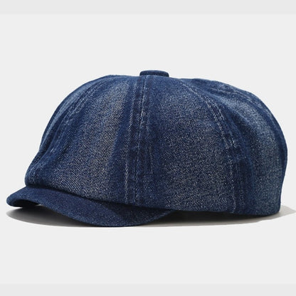Dark blue denim Newsboy cap with a comfortable fit and classic Baker boy style. Ideal for achieving a stylish vintage look with a modern edge.
