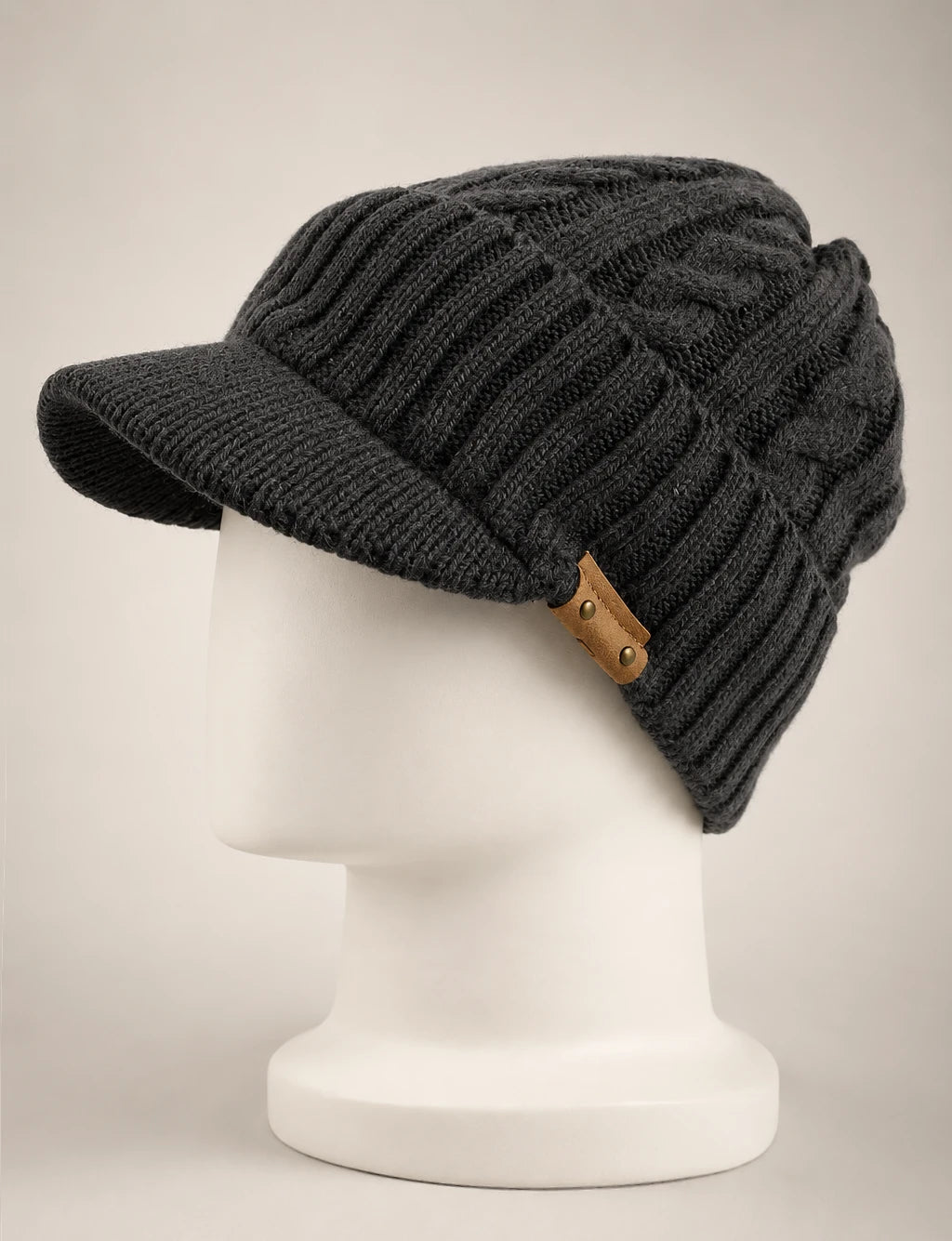 Dark gray cable knit visor beanie B5042 with textured ribbing and a soft knit brim.
